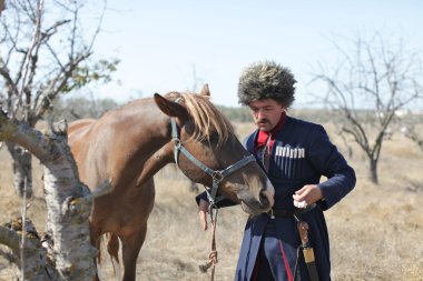 Ukrainian Cossack with horse clipart