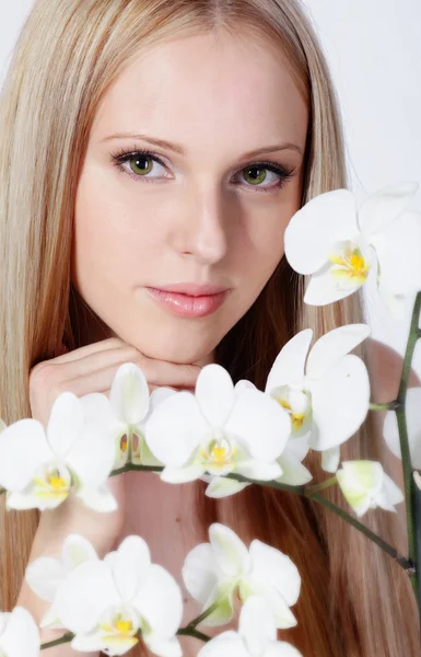 Girl with white orchid — Stock Photo, Image