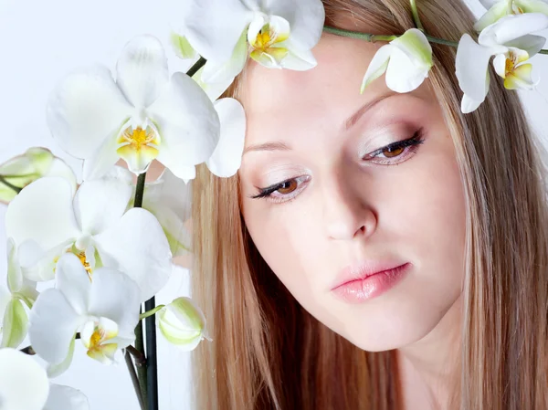 Girl with orchid — Stock Photo, Image