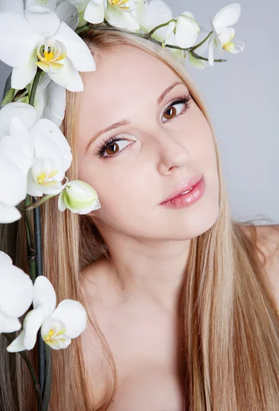 Girl with orchid — Stock Photo, Image