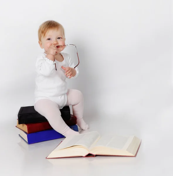 Baby with books — Stock Photo, Image