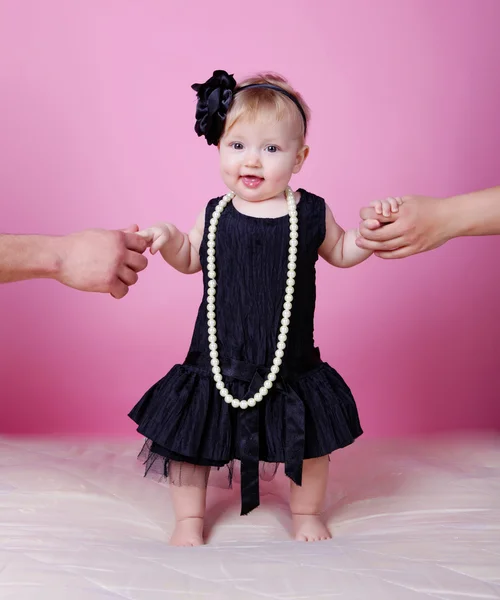 Little girl in black dress in studio — Stock Photo, Image