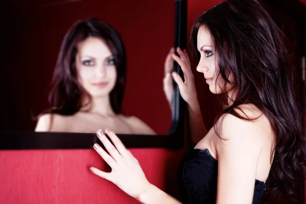 Beautiful girl in the mirror — Stock Photo, Image