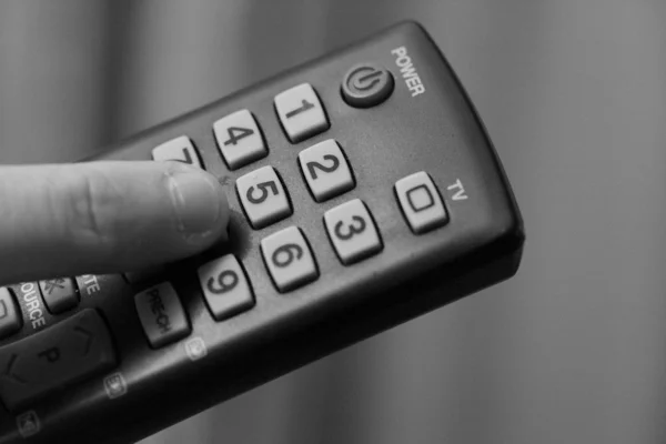 Tv Remote Control and Finger Royalty Free Stock Images