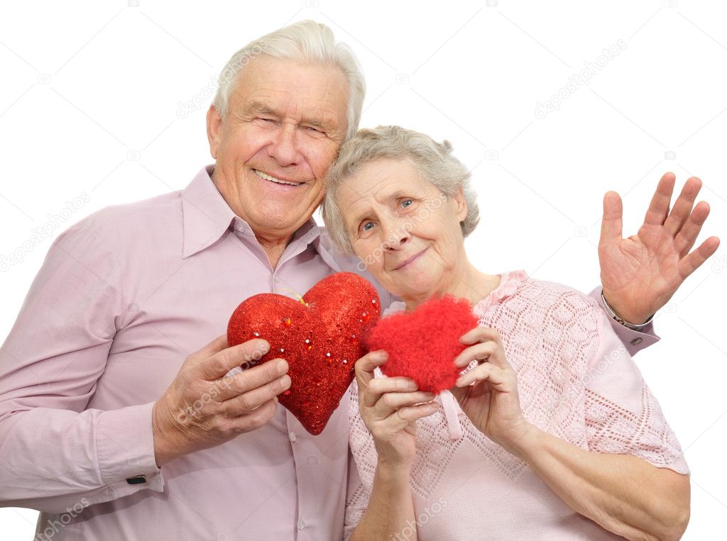 Happy old couple with red hearts