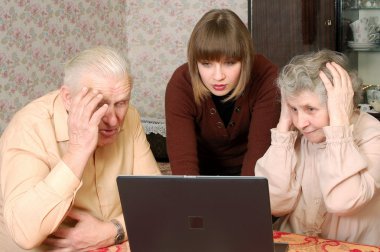 Grandparents and granddaughter looking in wide-eyed astonishmen clipart