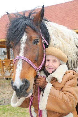 Portrait grandmother and horse clipart