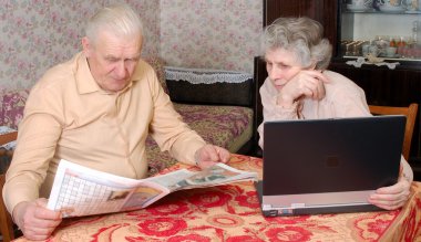 Old couplen reading hot news clipart