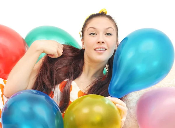 Girl with balloons look at camera — Stock Photo, Image