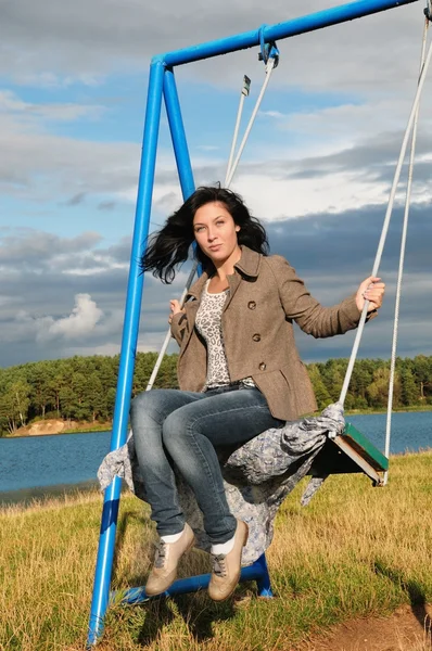 stock image Beautiful girl on swing