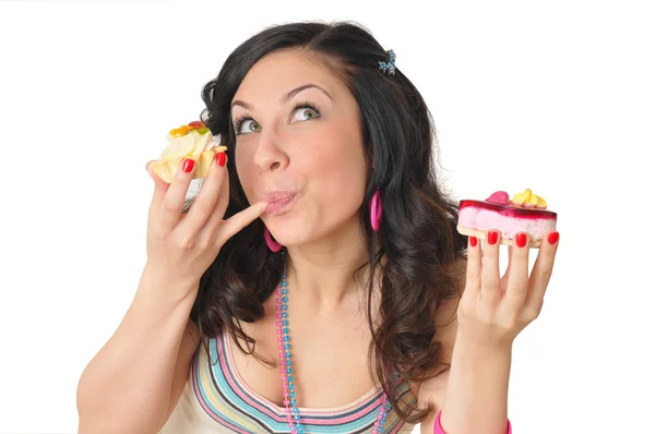 Милая девушка с двумя вкусными тортами — стоковое фото