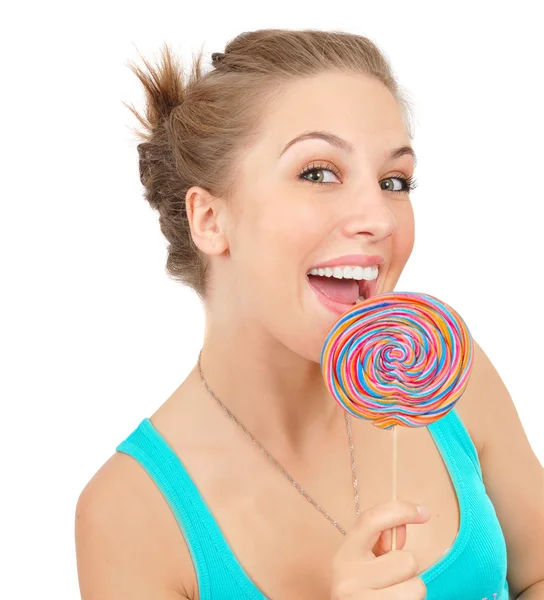 很快乐的女孩与她手里的棒棒糖 — 图库照片