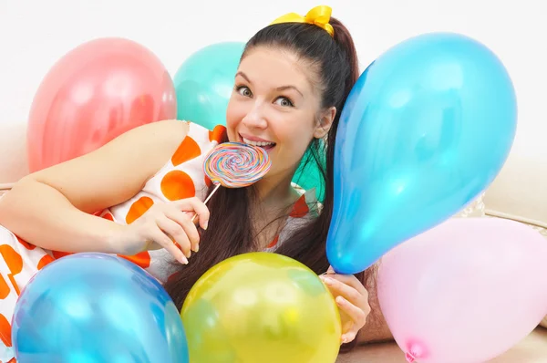 Cute girl among ballons — Stock Photo, Image