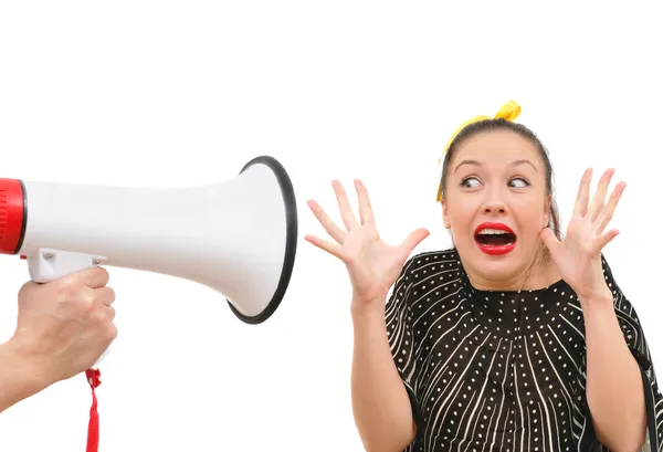 Fearful young woman and megaphone — Stock Photo, Image