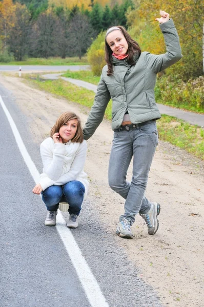 Pretty girls on road — Stock Photo, Image