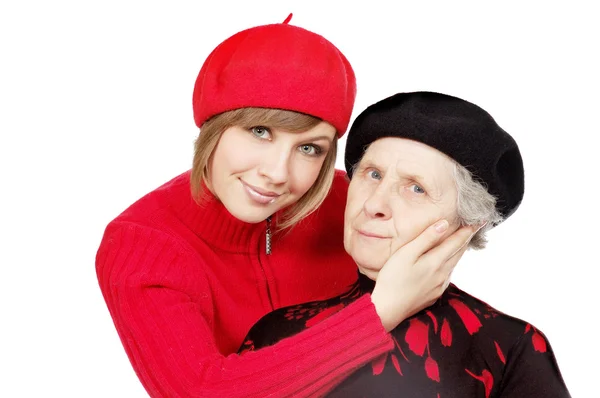 stock image Happy grandmother and granddaughter with berets