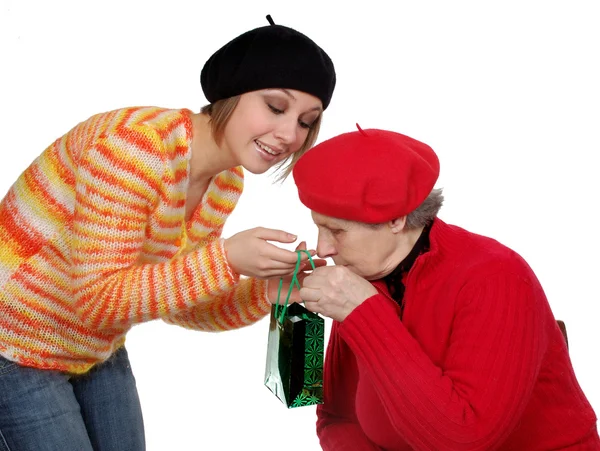 Grandmother and granddaughter with present — Stock Photo, Image