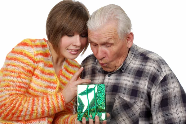 Grandfather and granddaughter with present — Stock Photo, Image