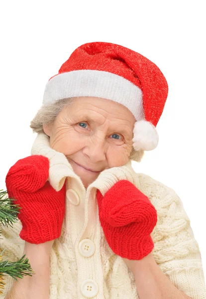 Frau mit rotem Weihnachtsmann-Hut und roten Handschuhen blickt in die Kamera — Stockfoto