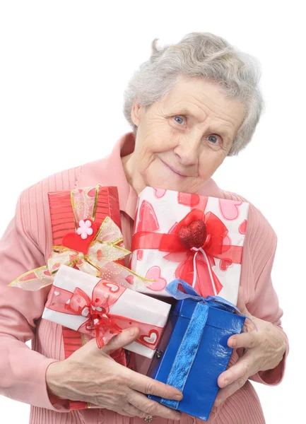 Old lady and boxes with gifts — Stock Photo, Image