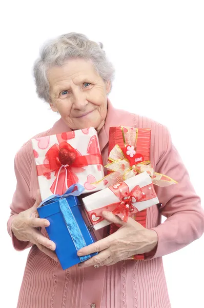 Old lady and boxes with gifts — Stock Photo, Image