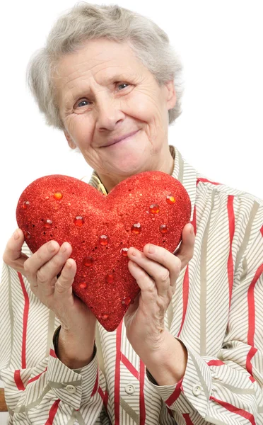 Seniorin mit Herz — Stockfoto