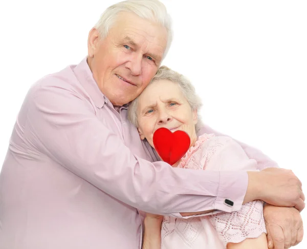 Happy old couple with red candy — Stock Photo, Image