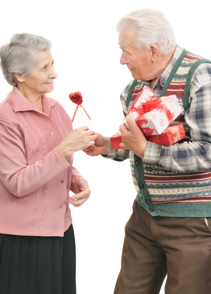 Senior men give gifts senior women — Stock Photo, Image