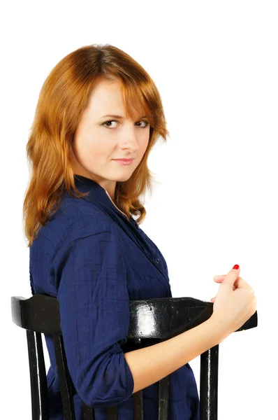 Portrait of beautiful sitting grimace brown-eyed girl — Stock Photo, Image