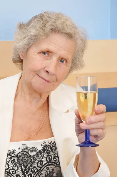 Mother with goblet of champagne Royalty Free Stock Images