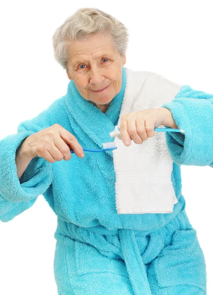 Idősebb hölgy fogkefe Stock Kép