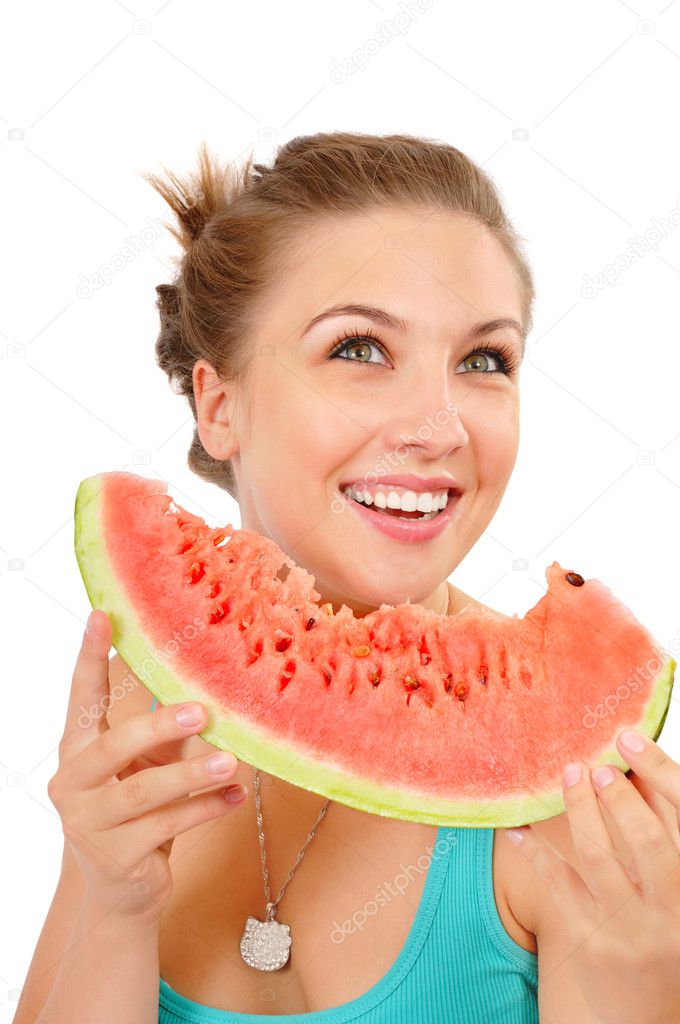 Smiling young woman eating watermelon