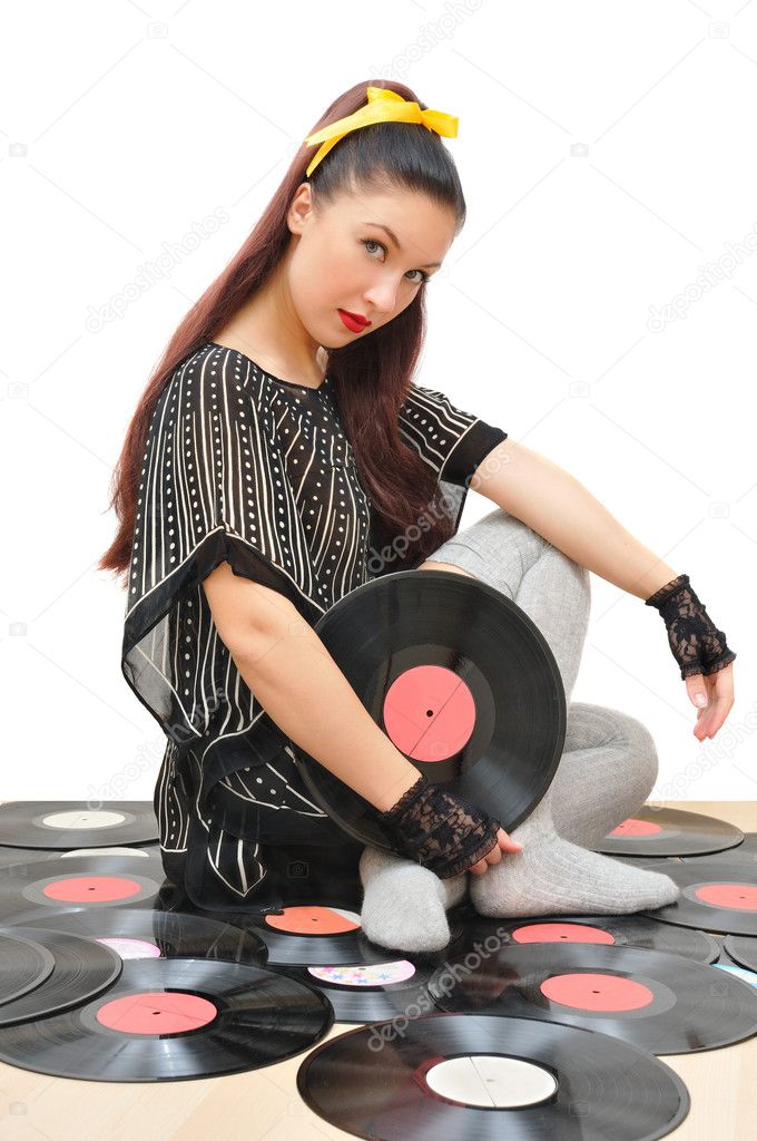 Stylish girl with vinyl discs