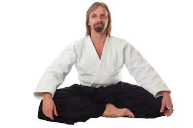 Pacification teacher of aikido sit and look at camera clipart