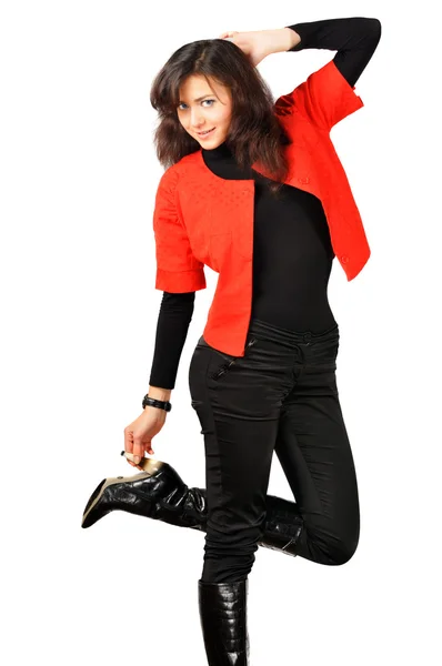 Szép, mosolygós, fiatal lány, piros-fekete ruhában pózol — Stock Fotó
