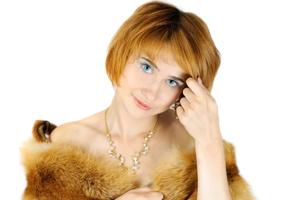 Portrait of beautiful blue-eyed woman correcting hairstyle — Stock Photo, Image