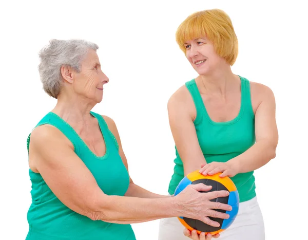 Daughter and mother doing gymnastics with ball — Stock Photo, Image