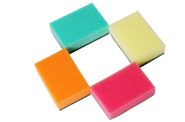 Четыре разноцветные губки — стоковое фото