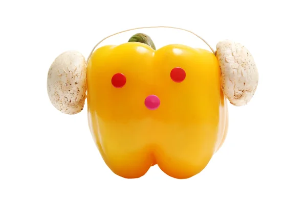 Cara divertida con auriculares de pimentón amarillo — Foto de Stock