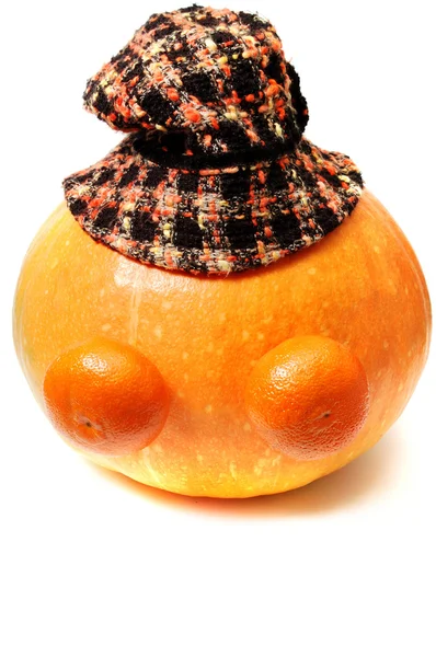 Funny face from pupkin two mandarins and hat above — Stock Photo, Image