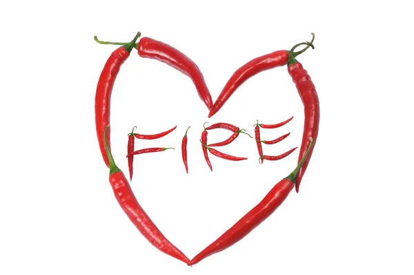 Red heart from pepper and word fire inside — Stock Photo, Image