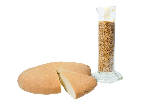 Bread near beaker — Stock Photo, Image