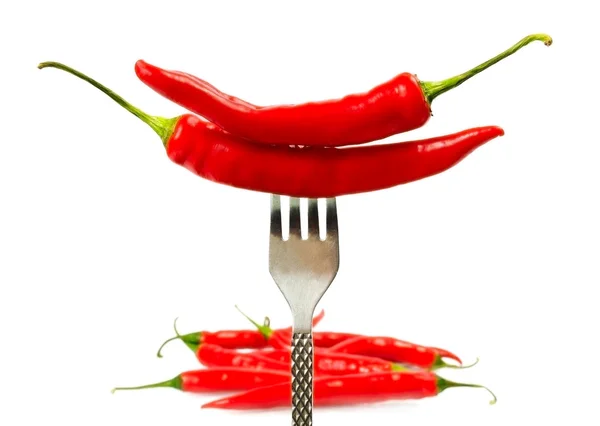 Några röd paprika på gaffeln — Stockfoto