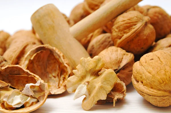 Walnuts and mallet — Stock Photo, Image