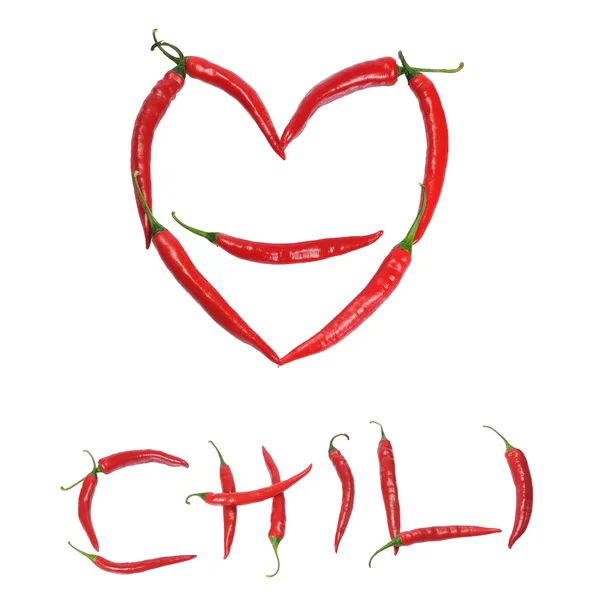 Chili peppers forming shape of heart — Stock Photo, Image