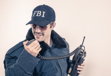 Investigative cocky FBI agent wearing blue jacket, sunglasses, and mustache clipart