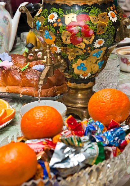 stock image Russian samovar on a table with sweets