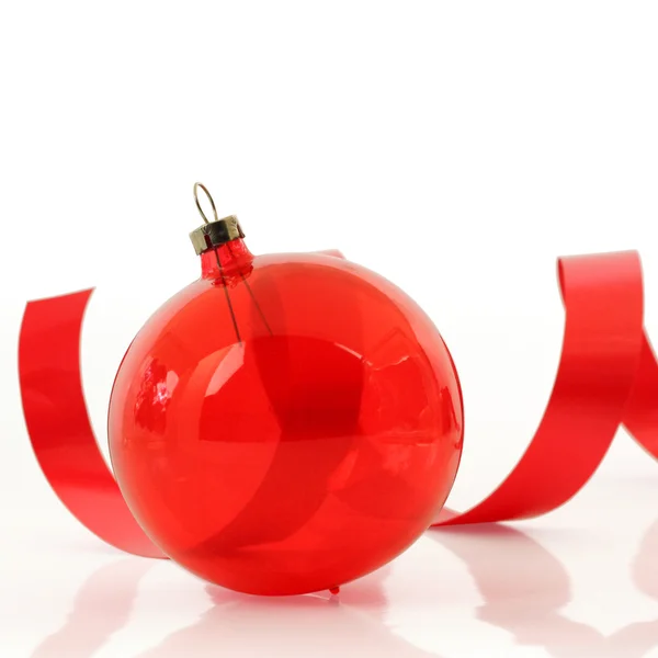 Red ornament with a ribbon — Stock Photo, Image