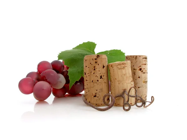 stock image Three corks with grapes