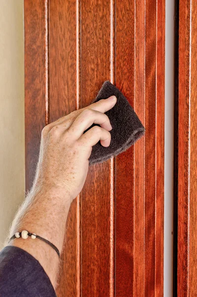 stock image Hand of man works on a window